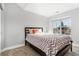 Bright bedroom with large window and carpeted floor at 7373 E Iowa Ave # 1101, Denver, CO 80231