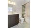 Stylish bathroom with dark vanity and bathtub at 7373 E Iowa Ave # 1101, Denver, CO 80231