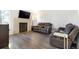 Spacious living room featuring a fireplace and comfortable seating at 7373 E Iowa Ave # 1101, Denver, CO 80231