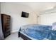 Bright bedroom with a queen-size bed and built-in dresser at 7373 E Iowa Ave # 1101, Denver, CO 80231