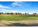 Open green space with distant view of homes and power lines at 7373 E Iowa Ave # 1101, Denver, CO 80231