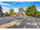 Community pool with cover, surrounded by trees and landscaping at 7373 E Iowa Ave # 1101, Denver, CO 80231
