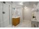 Basement bathroom with shower, vanity, and tile floors at 550 Winona Ct, Denver, CO 80204