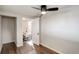 Bright bedroom with wood floors and access to an office at 550 Winona Ct, Denver, CO 80204