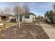 House exterior and nicely landscaped front yard at 550 Winona Ct, Denver, CO 80204