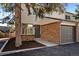 Modern townhouse exterior with gray garage door at 8447 W Dakota Ave # D, Lakewood, CO 80226