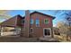 Two-story home with brown siding and a patio at 6485 Barnacle Ct, Boulder, CO 80301