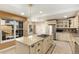 Spacious kitchen with island, granite countertops, and stainless steel appliances at 1581 S Syracuse St, Denver, CO 80231