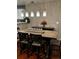 Bright dining room featuring a farmhouse table and six chairs at 19635 Montview Dr, Aurora, CO 80011