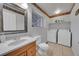 Bathroom with toilet, sink, and washer/dryer at 1199 S Waco St # E, Aurora, CO 80017