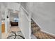 Bright entryway with staircase and view into living room at 1199 S Waco St # E, Aurora, CO 80017