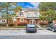 Townhouse exterior with parking spaces and landscaping at 1199 S Waco St # E, Aurora, CO 80017