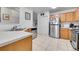 Kitchen with stainless steel appliances and wood cabinets at 1199 S Waco St # E, Aurora, CO 80017