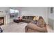 Spacious living room with L-shaped sectional sofa and fireplace at 1199 S Waco St # E, Aurora, CO 80017