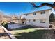 Ranch-style home with a covered patio and spacious backyard at 4451 E Lake N Cir, Centennial, CO 80121