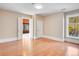 Spacious bedroom with hardwood floors and access to a sunroom at 965 N Pennsylvania St, Denver, CO 80203