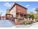 Brick two-story home with a classic design, inviting porch, and landscaped yard at 965 N Pennsylvania St, Denver, CO 80203