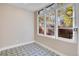 Bright laundry room with patterned tile floor and large windows at 965 N Pennsylvania St, Denver, CO 80203