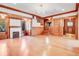 Spacious living room with hardwood floors, fireplace, and large windows at 965 N Pennsylvania St, Denver, CO 80203
