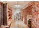Unfinished brick basement with wine rack and shelving at 965 N Pennsylvania St, Denver, CO 80203