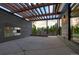 Modern patio with built-in fireplace and pergola, offering scenic mountain views at 27 Boulder Cir, Breckenridge, CO 80424