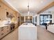 Modern kitchen with large island, stainless steel appliances, and light wood cabinets at 27 Boulder Cir, Breckenridge, CO 80424