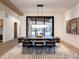 Open concept dining room with modern chandelier and large windows at 27 Boulder Cir, Breckenridge, CO 80424
