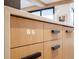 Close up of kitchen island with light wood cabinets and quartz countertop at 27 Boulder Cir, Breckenridge, CO 80424