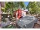 Landscaped backyard with detached garage and covered car at 403 W 3Rd Ave, Denver, CO 80223