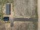 Overhead view of a house and detached garage at 15 S County Road 197, Byers, CO 80103