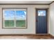 Bright living room with large windows and hardwood floors at 15 S County Road 197, Byers, CO 80103
