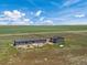 Aerial view of home and detached garage on acreage at 15 S County Road 197, Byers, CO 80103