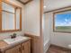 Clean bathroom with a vanity and bathtub at 15 S County Road 197, Byers, CO 80103