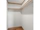 Walk-in closet with wood shelving and hanging rod at 15 S County Road 197, Byers, CO 80103