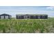 Gray house with attached garage and detached shed at 15 S County Road 197, Byers, CO 80103