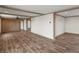 Spacious living room featuring hardwood floors and wood beams at 15 S County Road 197, Byers, CO 80103