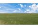 Aerial view of expansive land with a home and outbuildings at 15 S County Road 197, Byers, CO 80103