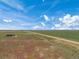 Aerial view of a long dirt road through farmland at 15 S County Road 197, Byers, CO 80103