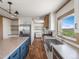 Modern farmhouse kitchen with a large island and farm sink at 15 S County Road 197, Byers, CO 80103