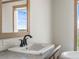 Clean bathroom with vanity and window view at 15 S County Road 197, Byers, CO 80103