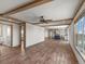Open concept living area with wood flooring and access to kitchen at 15 S County Road 197, Byers, CO 80103