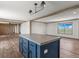 Kitchen island view showcasing the open floor plan at 15 S County Road 197, Byers, CO 80103