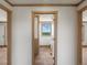 Hallway with access to bathroom and bedrooms at 15 S County Road 197, Byers, CO 80103
