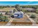 Aerial view of a house with a large yard and surrounding neighborhood at 4550 Miller St, Wheat Ridge, CO 80033