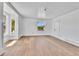 Spacious living room featuring hardwood floors and multiple windows at 4550 Miller St, Wheat Ridge, CO 80033