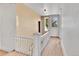 Upper hallway with wooden floors and white railings at 4550 Miller St, Wheat Ridge, CO 80033