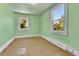 Simple bedroom with hardwood floors and light green walls at 4550 Miller St, Wheat Ridge, CO 80033