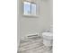 Simple bathroom with toilet and vinyl flooring at 4550 Miller St, Wheat Ridge, CO 80033