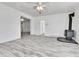 Living room with wood-look flooring and a wood-burning stove at 4550 Miller St, Wheat Ridge, CO 80033