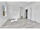 Bright bedroom features wood-look flooring and ample natural light at 4550 Miller St, Wheat Ridge, CO 80033